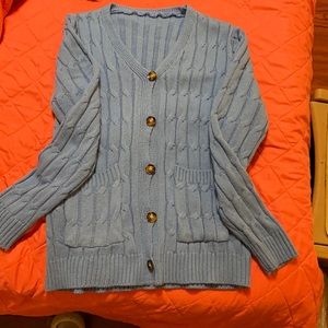 Women’s blue Amazon sweater size medium.